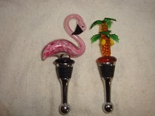 PAIR OF GLASS WINE STOPPERS