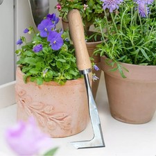 Outil de désherbage en forme