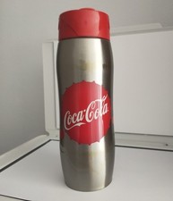 gourde coca cola de collection gris avec une capsule rouge