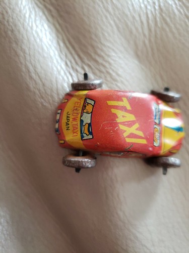 Vintage miniature yellow taxi - miniature,
