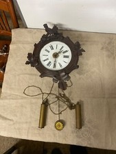 Horloge à balancier en bois