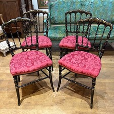 Série de quatre chaises Napoléon III, bois laqué noir et rechampi or