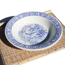 Plat rond creux en faïence de