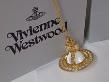 Vivienne Westwood- Collier Saturne Pina or et cristaux transparents.