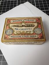 boîte de plumes scellée