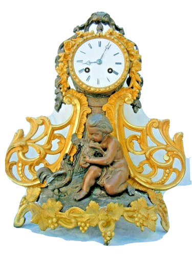 Pendule dore sculpture enfant