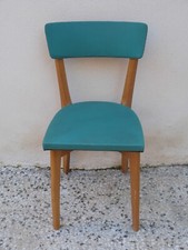 Chaise en bois et skaï vert