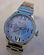 MONTRE BREIL DAME, Movt SUISSE RONDA ,LUNETTE SERTI DE SWAROVSKI,TBEG & FONCTION