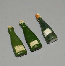 - 3 FEVES BOUTEILLES de CHAMPAGNE 1ere époque 1 avec bouchon en partie Rouge  D