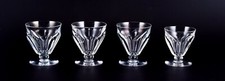 Baccarat, France.  Lot de quatre verres Art Déco en cristal à facettes.