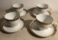 4 tasses à café et soucoupe