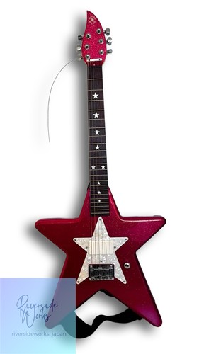 Guitare électrique rose ultra