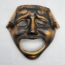 Masque mural en bronze patiné