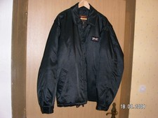 Blouson SCHOTT NYC, noir, en vinile, jamais porté. TBE.