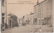 CPA SAINT-AMANT-TALLANDE (63) LA GRANDE ROUTE - ANIMEE - ATTELAGE DE BOEUFS