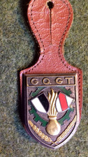 PUCELLE INSIGNE SUR CUIR TRAIN G.Q.G.T GROUPEMENT QUARTIER GENERAL ET TRANSPORT