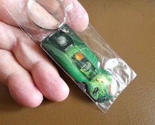 Porte clé métal PERRIER JUICE (fait office de jeton de caddie) Neuf scellé.