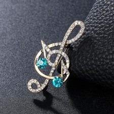 Broche bijou clé de sol doré