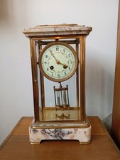 Élégante pendule 4 glaces, balancier mercure, fonctionne.