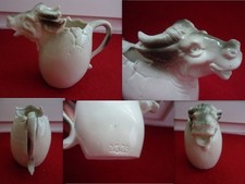 ANCIEN PETIT PICHET POT A LAIT FORME TETE DE  VACHE EN PORCELAINE NUMEROTE 2329