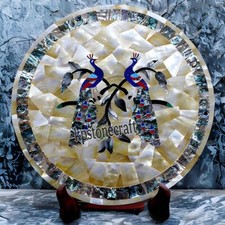 Assiette incrustation paon |