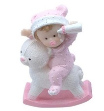 Figurine sujet baptême - Bébé fille cheval à bascule - polyrésine rose et blanch