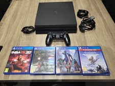 Console PS4 Pro 1 To + 4 jeux