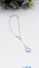 Bracelet or blanc orné de 4 topazes facettées dont une pendante Or 375 Millième