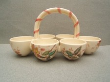 ancien porte oeufs coquetier en céramique signé Georges Dreyfus décors de fleurs