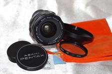 Objectif M42 28mm f3,5 TAKUMAR SMC bouchons, filtre 1A, pare-soleil, housse TBE