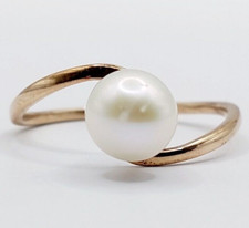 Bague vintage or rose 14k perle dans une monture à enroulement