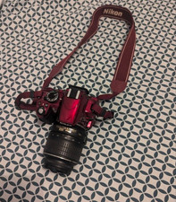 Nikon D3100 rouge en très bon état
