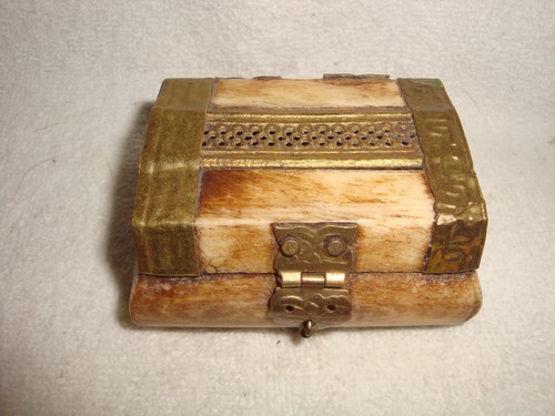 Soap stone and brass - stone,