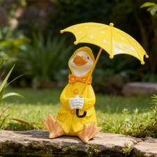 Canard tenant un parapluie