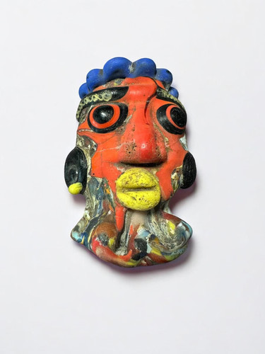 Pendentif amulette visage