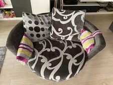 Fauteuil rond tournant gris coussins