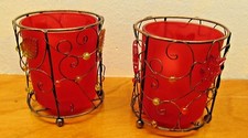 wire and red glass votive