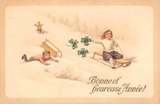 CPA FANTAISIE / BONNE ANNEE / ENFANTS A LA LUGE
