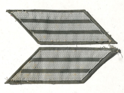 06318 patte col tissu - de,