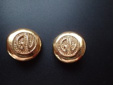 boucles d'oreille signées GUY