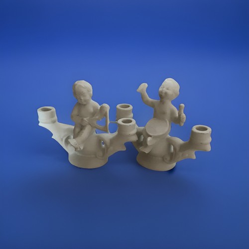 Deux petits bougeoirs putti - deux,