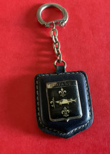 Porte clé vintage, années 50/60 cuir noir métal émaillé Emblème RENAULT DAUPHINE