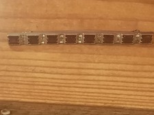 Broche vintage Art Déco – Strass rouges et transparents, monture argentée