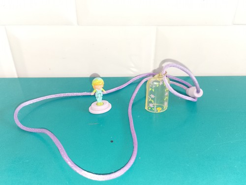 Polly pocket figurine doll