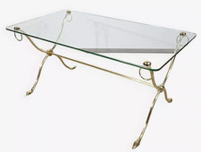 JANSEN table basse en laiton, piétement entretoise et pieds en forme de cygnes