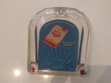 Shell. rendu monnaie .Station service.