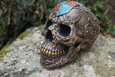 766.7529 TETE MORT FIGURINE