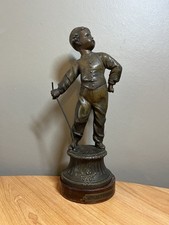 Statue enfant régule patiné