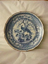 Belle assiette porcelaine bleue decor oiseau marquée au dos