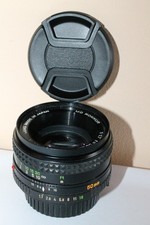 Minolta MD Rokkor 50 mm 1,7 + 2 bouchons